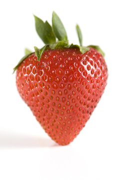 Close-up of single strawberry isolated on white background