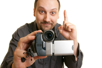 man shoots video with a camera