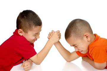 Kids arm-wrestling, isolated on white