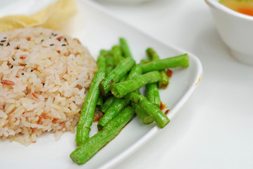Healthy unpolished red rice and beans