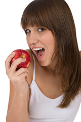 Female teenager eat apple for breakfast