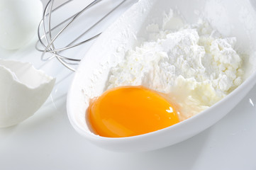 close up yolk and flour