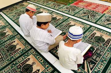 Muslim Boy Reading Koran