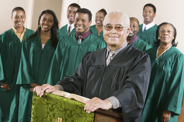 minister at podium with gospel choir portrait