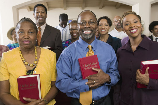 sunday service congregation standing in church with bibles portrait