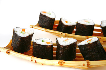 served sushi on bamboo