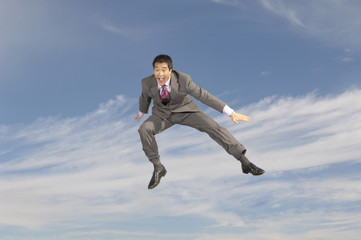 Fototapeta na wymiar business man crouching mid-air outdoors