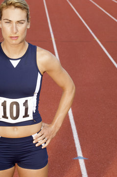 female athlete on running track half length
