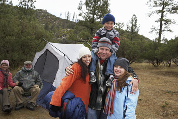 family with children (7-12) camping (portrait)