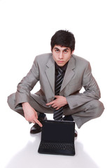 Business man displaying a laptop