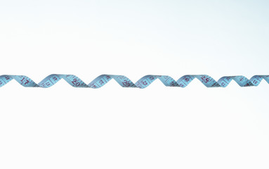 twisted strip of measuring tape detail