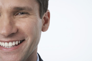 Obraz premium smiling businessman cropped close-up
