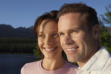 Obraz premium couple outdoors by lake.