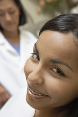 teenage girl (13-16) at dentists (close-up)