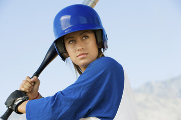 young woman with softball bat portrait