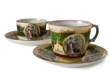 two antique teacups on a white background
