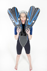 young woman wearing neoprene with flippers and diving goggles