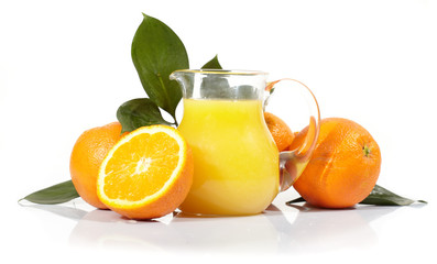 Orange juice and oranges on a white background.