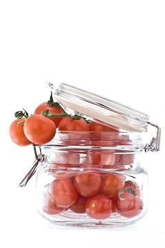 Canning Jar Holding Small Vine Tomatoes