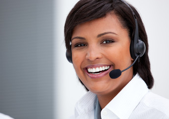 Portrait of an ethnic customer service agent at work