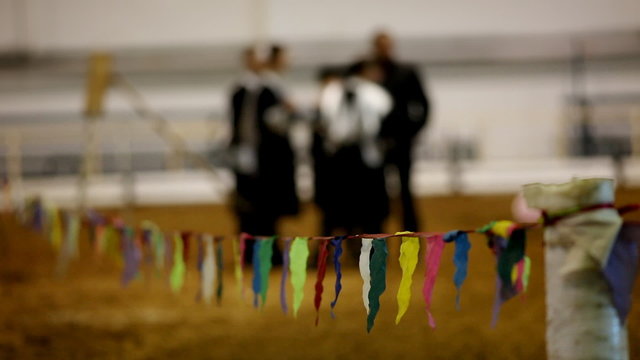 Flag barrier with peoples on background