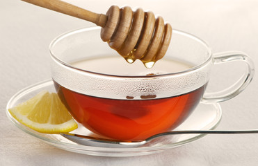 Hot Tea In Glass Cup With Honey And Lemon