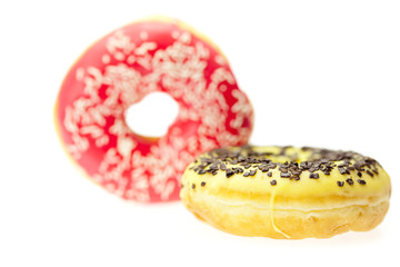 Donut with chocolate and colorful sprinkles, isolated on white