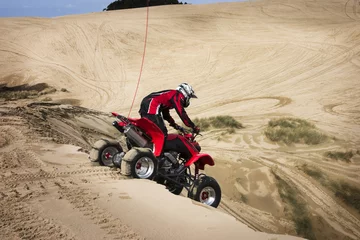 Foto op Aluminium Teenager Riding ATV in Sand Dunes © Raven