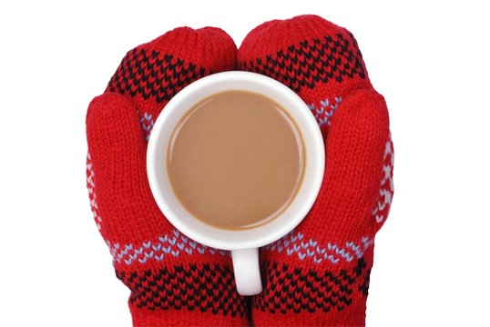 Gloved Hands Holding Mug