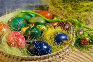 Coloring Easter eggs in basket