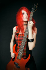 Redhead rocker girl with guitar
