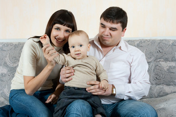 happy family - father, mother and baby