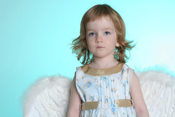 A little (three year old) girl with angel wings