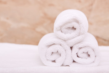 Fototapeta na wymiar Rolled up bath towels