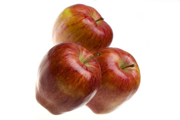Fototapeta na wymiar Three juicy apples lay on white background