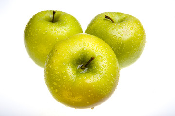 Three juicy apples lay on white background