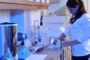 A biology laboratory assistant working