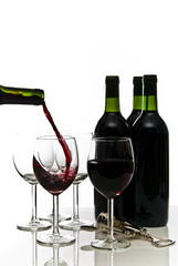 bottles of red wine and wineglasses