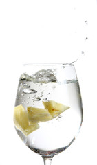 Fruit falling in a glass