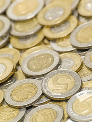 Scattered polish coins. Shallow DOF. Focus on 5.