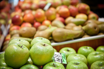 Red and green apples and pears at the farmers market
