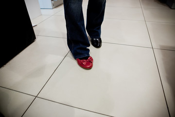 Adult woman trying on shoes in a store