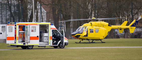 A Rescue team with helicopter and  ambulance