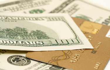 gold credit card and dollars