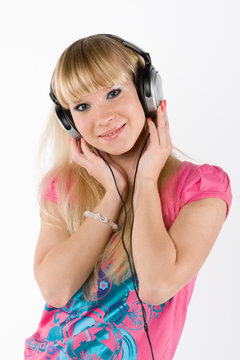 blonde girl with headphones on white