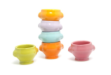 stack of colorful bowls over white background