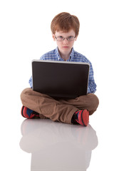 cute boy playing computer