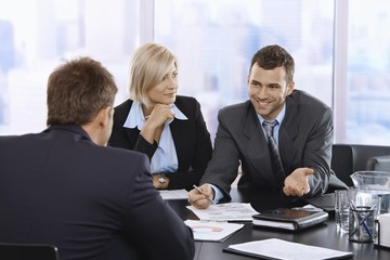 Businessman smiling at meeting