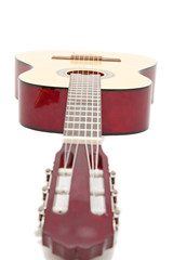 a yellow acoustic guitar isolated on white