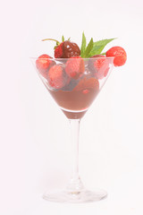 Strawberry and mint around a martini glass